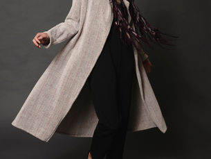 Models wearing unique handwoven coats and jackets