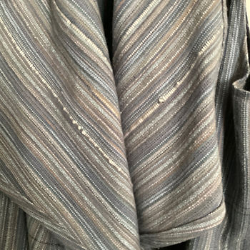 Handwoven fabric that has texture suggesting raindrops on a windowpane.
