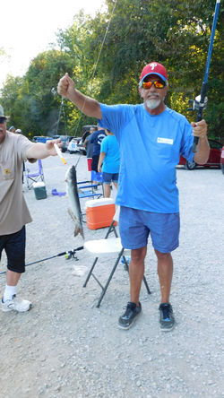 Peter showing off the fish he caught