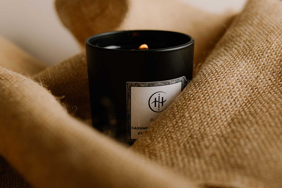 Suede Tonka candle in black matte glass, wrapped in soft caramel fabric