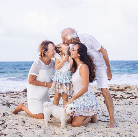 Family in love posing outdoors during a beach photoshoot in West Palm Beach