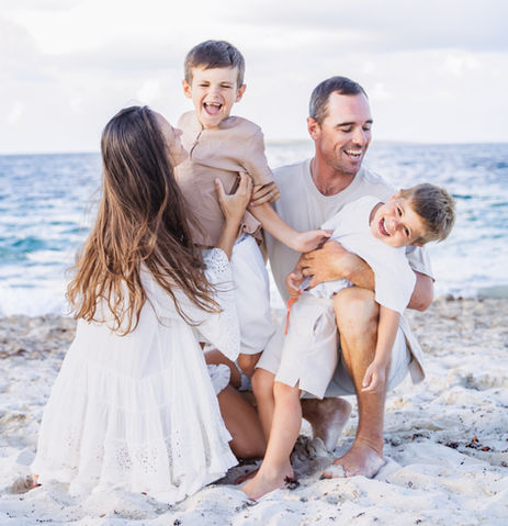 Family in love posing outdoors during a beach photoshoot in West Palm Beach