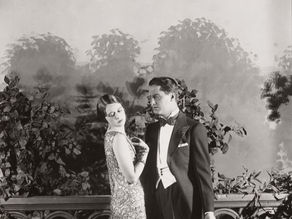 Daisy and Gatsby: A scene from the first stage adaptation of The Great Gatsby.