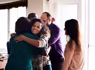 friends-hugging-each-other_53876-52406.avif