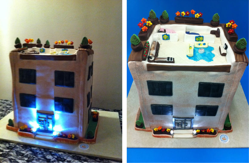 Fondant building cake designed for an architect with rooftop floor plan, windows, lights and edible furniture.