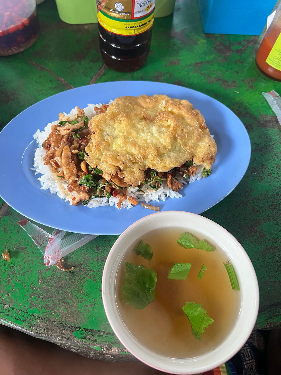 Local pad krapow with omelet and soup