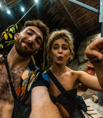 A man and woman posing for a selfie