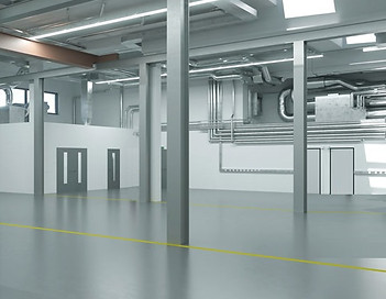 Leere Produktionshalle. LED Beleuchtung ist eine energieeffiziente, langlebige und intelligente Lösung, die die Sicherheit und Produktivität in deiner Halle verbessern kann.