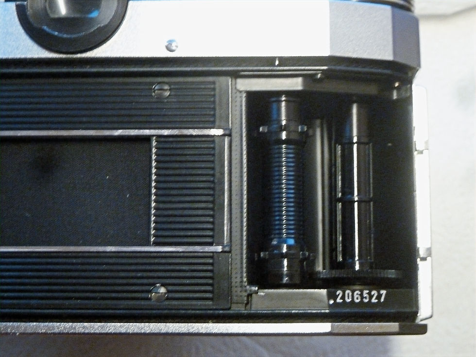 Camera back open on Nova B showing body number