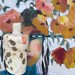 ceramic vase hand painted in front of abstract portrait painting