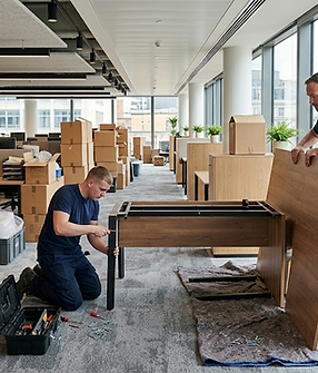 movers-dismantling-desk.png