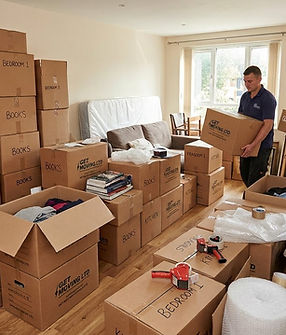 move carrying a box in a apartment move in South East London.