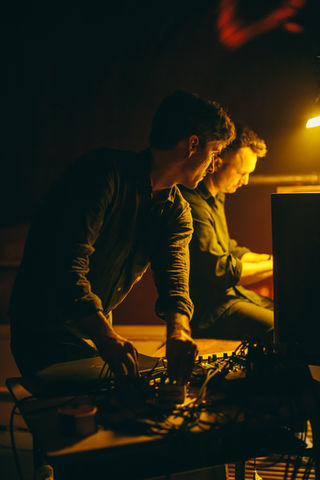 adrian foster and joel peters playing organ and manipulating sound waves at a montreal concert