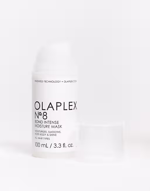 A bottle of OLAPLEX Nº8 Bond Intense Moisture Mask with its clear cap beside it, displayed on a white background. Included in the DCHAN SALON blog post