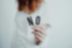 Person holding a card that says NO – representing ingredients to avoid in shampoos