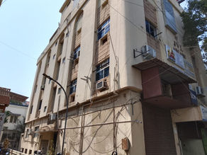 Commercial cum residential building for sale in T Nagar Chennai near main road with shop frontage and apartments
