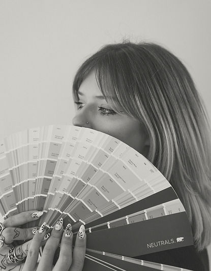 Woman holding color swatches, design