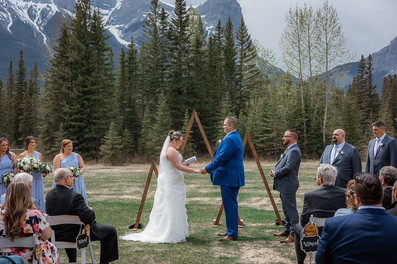 bride and groom holding hands at wedding ceremony