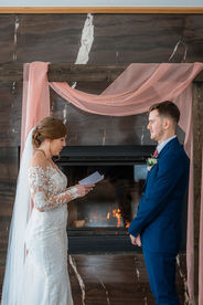 wedding ceremony with bride reading vows