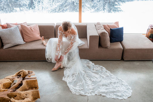 bride getting ready and putting on shoes