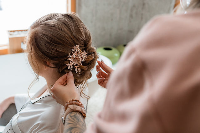 Getting ready bride fixing hair