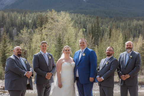 bride and groom with groomsmen photos