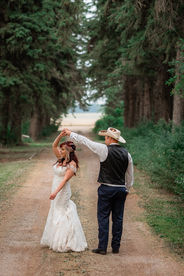 bride and groom dancing outdoors