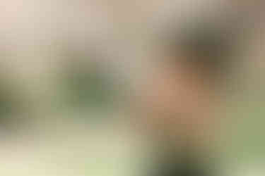 Toddler playing with flower