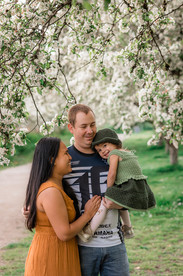 Family photo underneath the cherry tree blooms