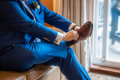 groom putting on shoes
