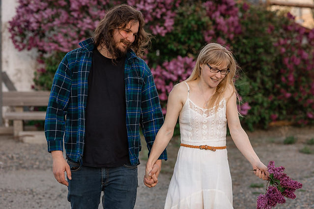 Couple walking hand in hand smiling