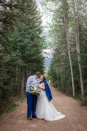 bride and groom kissing outdoors