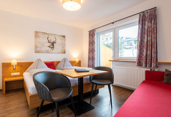 Comfort Dreibettzimmer mit Doppelbett und Schlafsofa