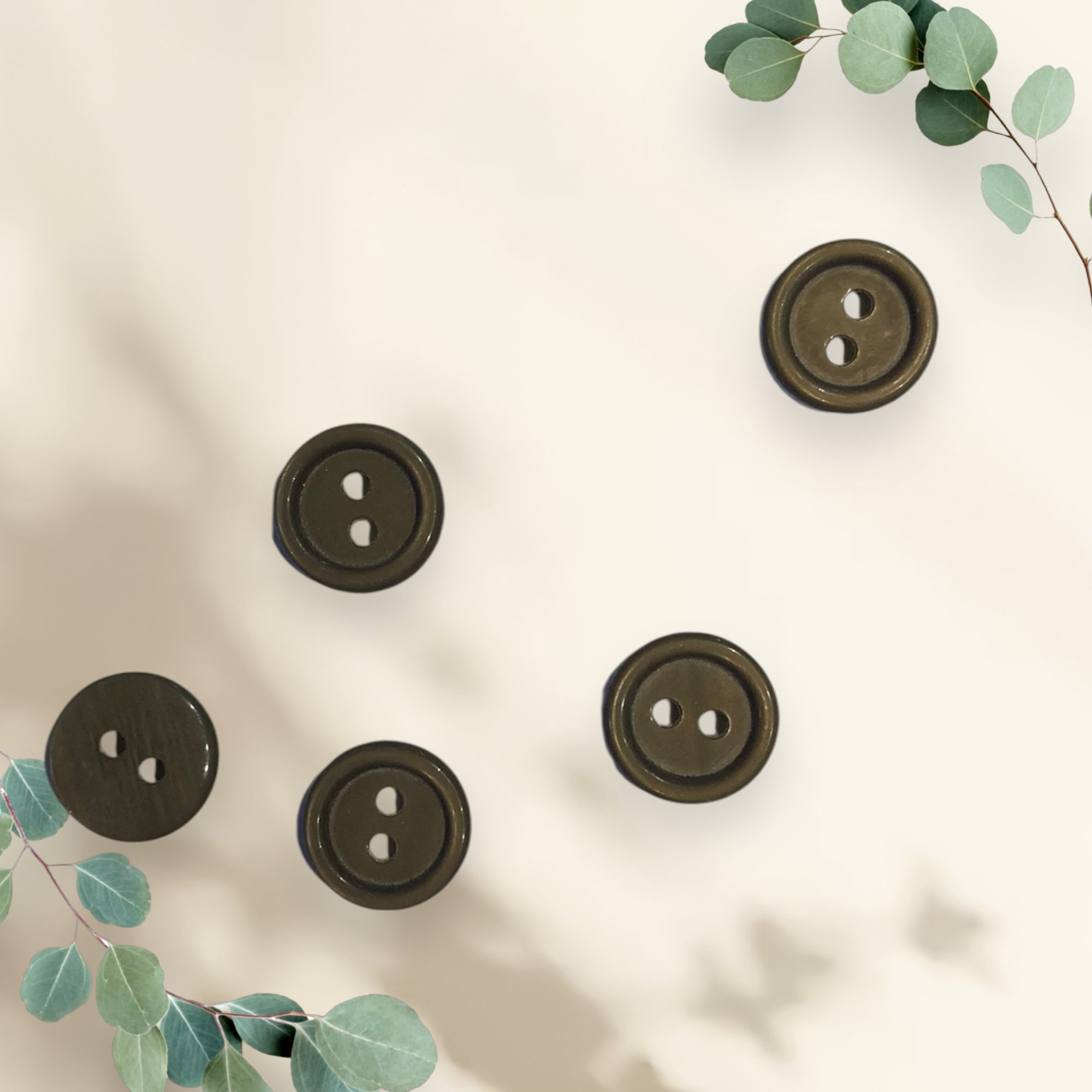 Buttons: Round 2 holes, brown, plastic