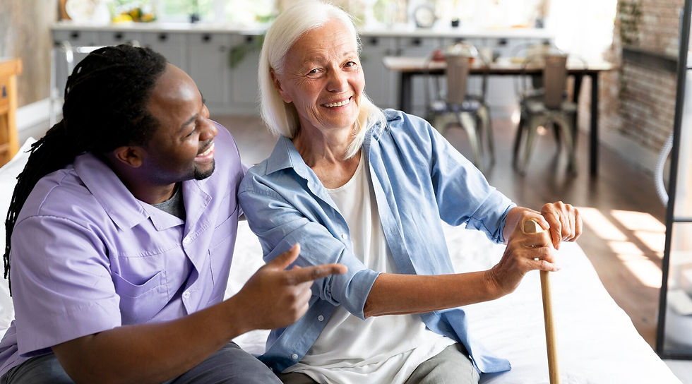 Senior living worker caring for older woman