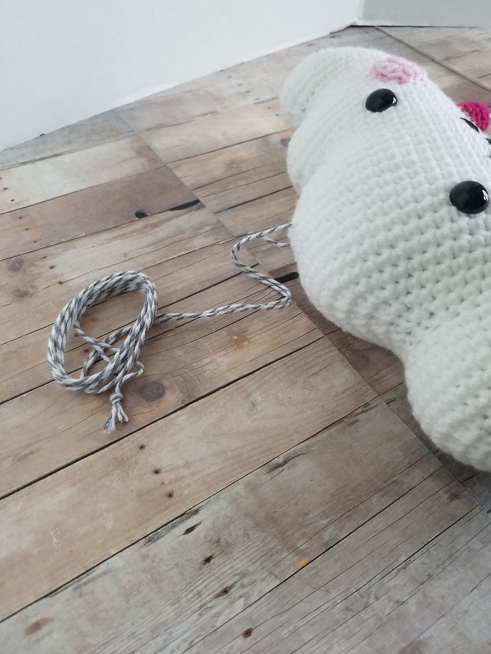 Thumbnail: A gray and white twist bakers twine hanger extends three feet from the top of the cloud.