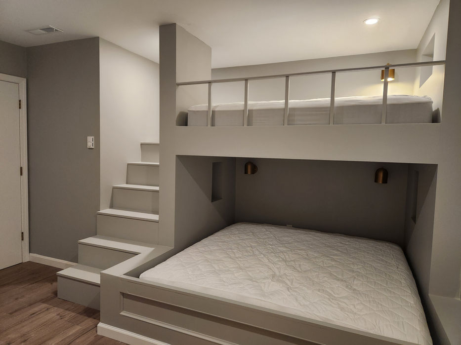 Built-in custom bunk beds with integrated steps.