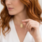 Woman wearing an 18-inch silver custom envelope necklace. An elegant, personalized heirloom gift for her.