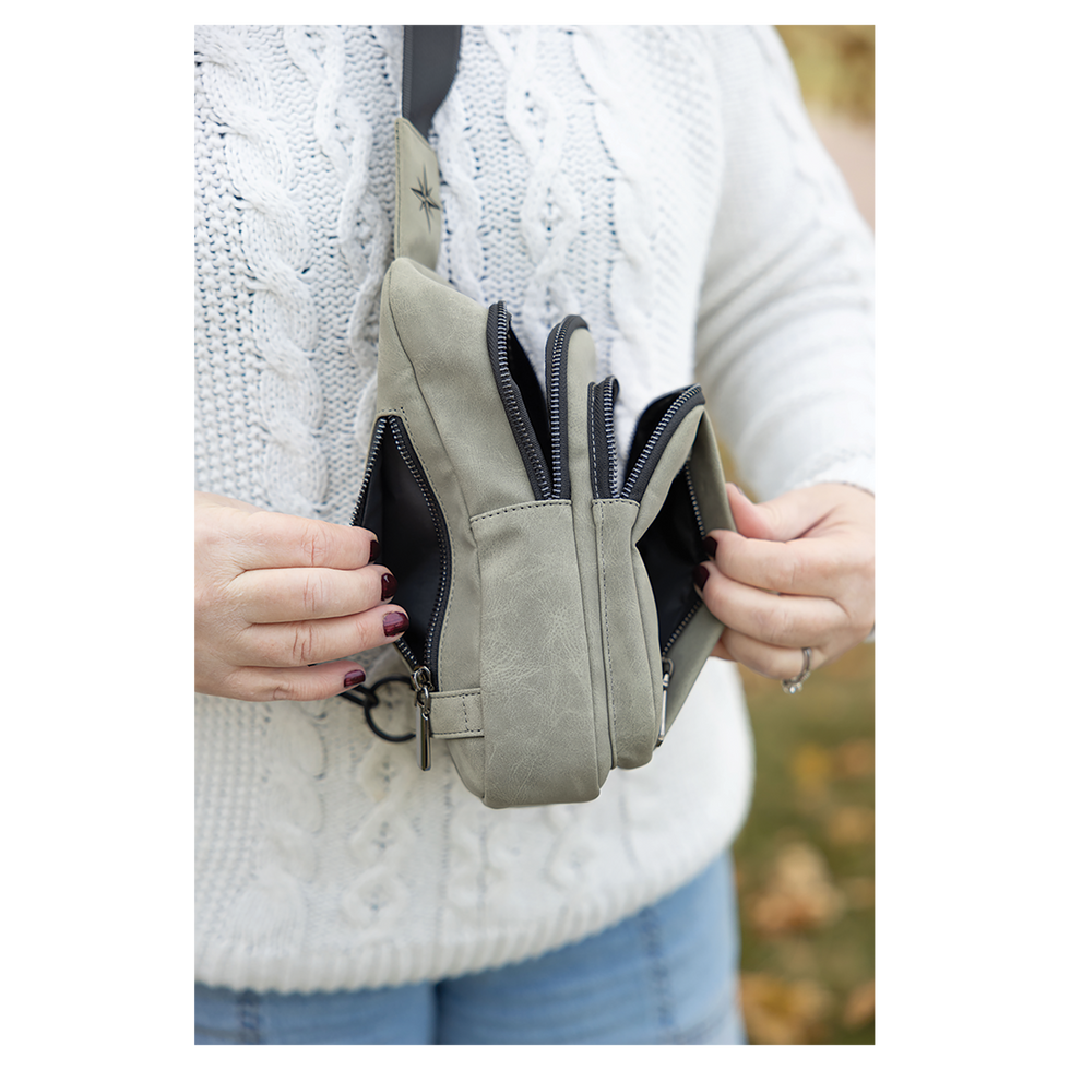 Roomy interior of The Expedition bag featuring secure zipper closures and a dedicated front smartphone pocket.