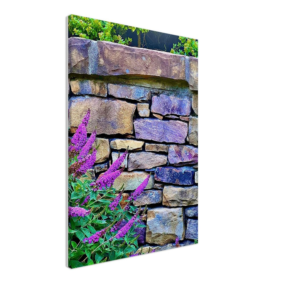 Thumbnail: Natural stone wall with purple flowers 