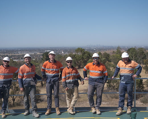The Adams Civil crew on site with the Melbourne skyline behind them