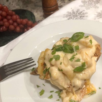 Close up view of Loaded Pulled BBQ Chicken Mac N Cheese Baked Potato