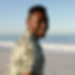 an-african-american-man-enjoying-free-time-on-beac-2022-02-02-03-56-22-utc-2.png