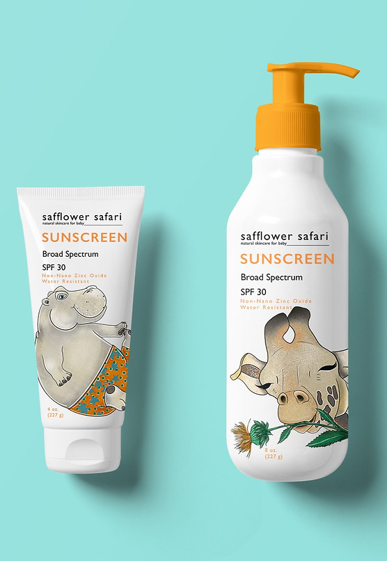 Safflower Safari sunscreen in a pump and in a tube. The tube has an image of a playful hippo in swim trunks and the pump has a giraffe smiling with its eyes closed holding a safflower in its mouth.