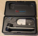 A dermatoscope in a case