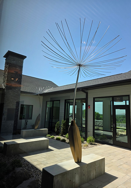 Photo of dandelion seed statue in the center atrium of the Children's Justice Center
