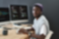 young-confident-african-american-it-support-manager-looking-camera-while-sitting-by-workpl