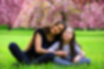 Happy beautiful young woman with girl in