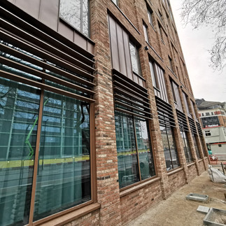 solar shading, brise soleil, facade, canopy, screens, rectangular fins, PPC, powder coated, bronze, horizontal blind, horizontal fin, fixed to curtain walling, projecting solar shading