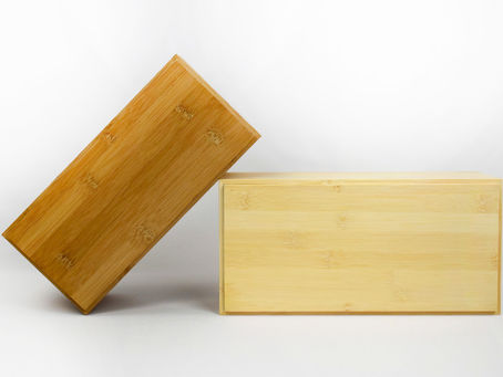French luxury wooden packaging manufacturer showcasing two bespoke wooden presentation boxes made in France.